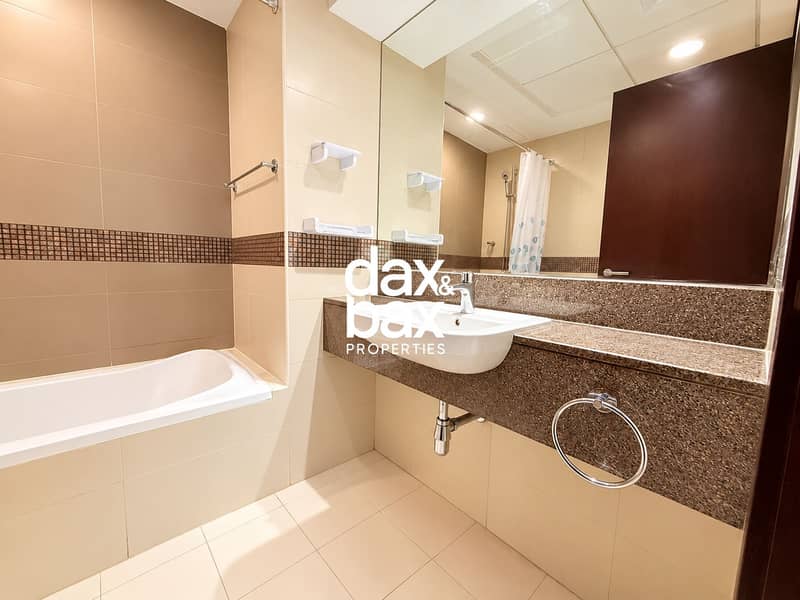 10 Modern Beige-Tiled Bathroom Interior. png