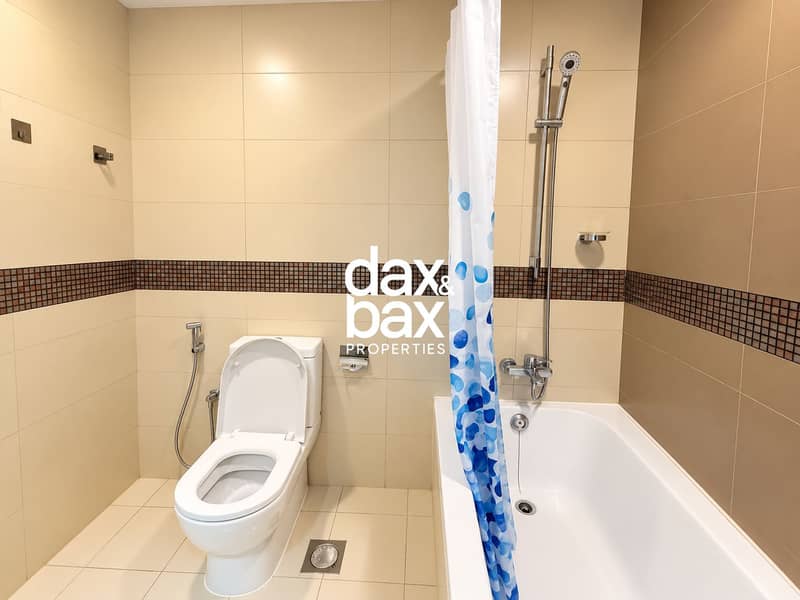 12 Modern Beige Tiled Bathroom. png