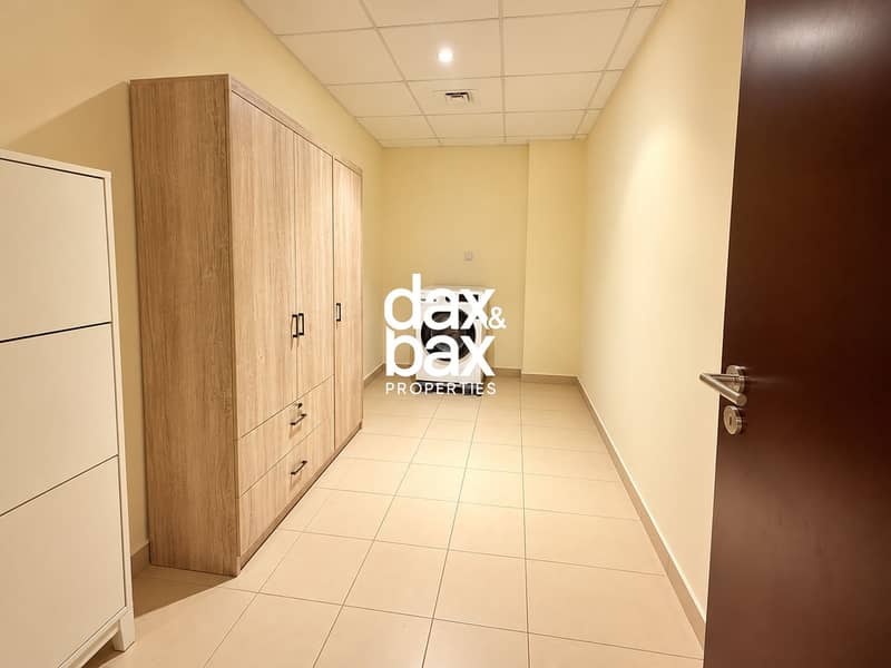 13 Minimalist Laundry Room with Oak Storage. png