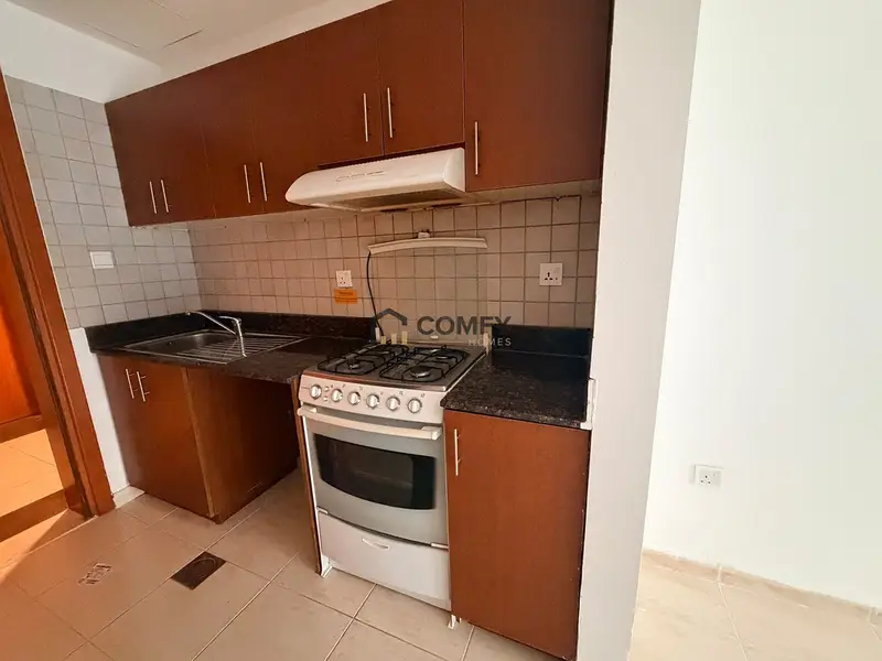 Unfurnished Studio | Skycourts Tower F | Community & Pool View