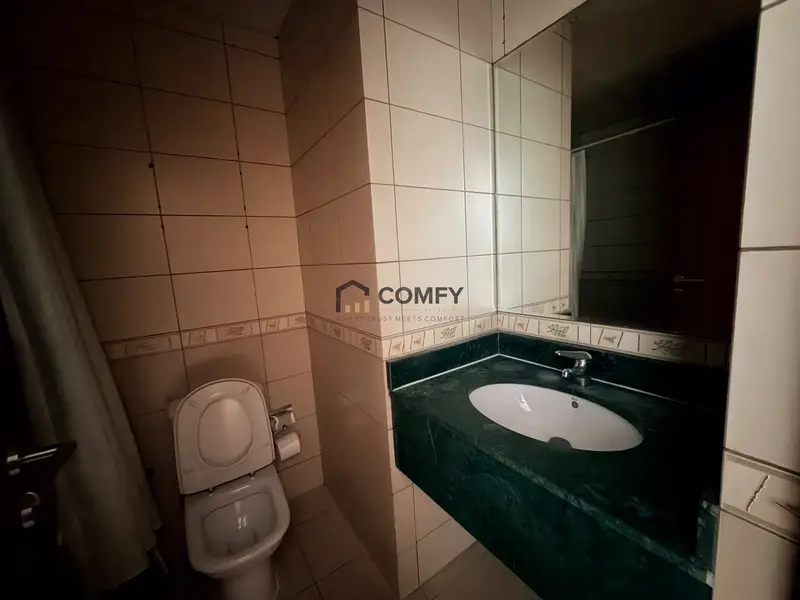Unfurnished Studio | Skycourts Tower F | Community & Pool View