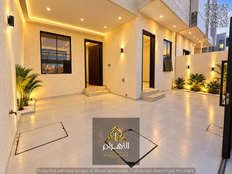 فناء مدخل عصري بإضاءة دافئة. jpg فناء مدخل عصري بإضاءة دافئة. jpg
