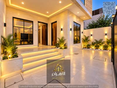 5 Camere Villa in vendita a Al Zahya, Ajman - مدخل منزل عصري بإضاءة ذهبية ونباتات خلابة. jpg