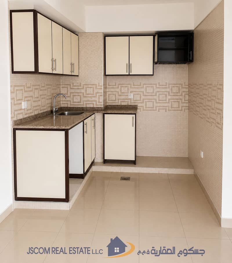 2 Compact Beige Tiled Kitchenette. png