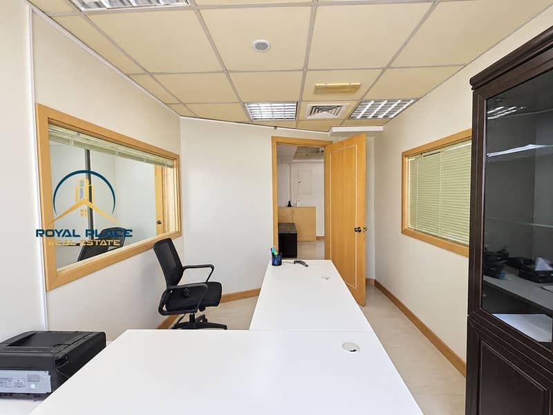 3 Bright, tidy office with open doorway. png