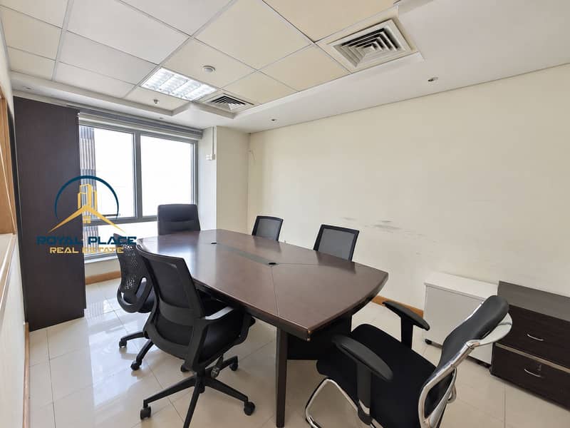 7 Natural-light conference room with dark table. png