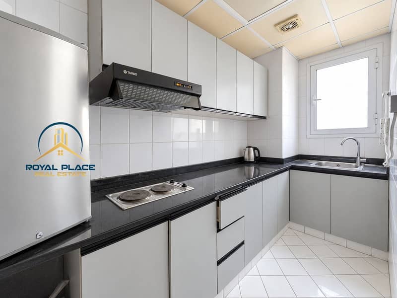 18 Bright, polished office kitchenette. png