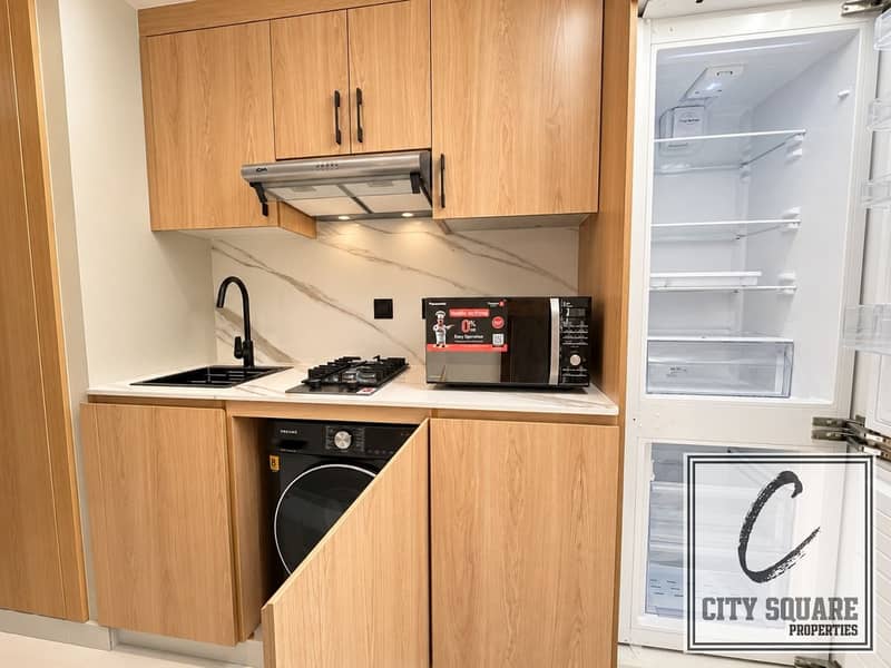 7 resize_Modern Compact Kitchenette with Open Refrigerator. jpeg
