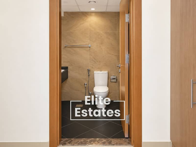 7 Modern Beige-Tiled Bathroom Interior. png