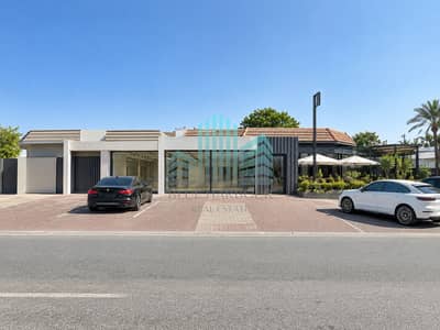 朱美拉住宅区, 迪拜 商铺待租 - Modern Storefront in Sunlit Parking Lot. png 朱美拉住宅区, 迪拜 商铺待租 - Modern Storefront in Sunlit Parking Lot. png