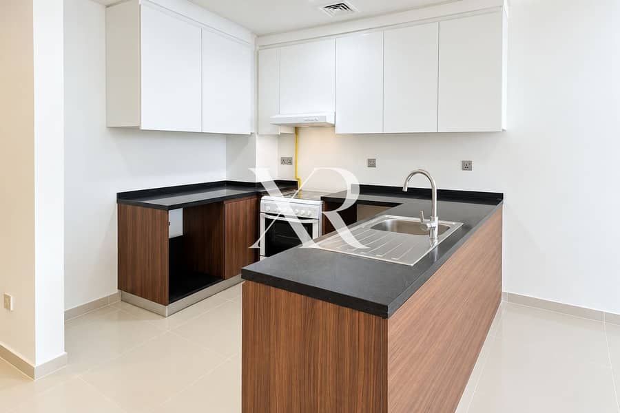 3 Bright Minimalist Walnut and White Kitchen. png