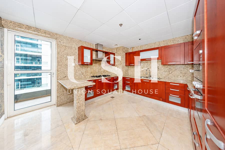 2 Luminous luxury kitchen with rich wood. png