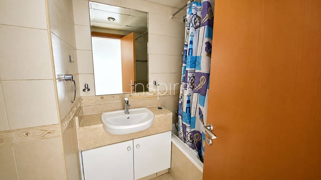 8 Modern Beige Bathroom with Nautical Shower Curtain. png