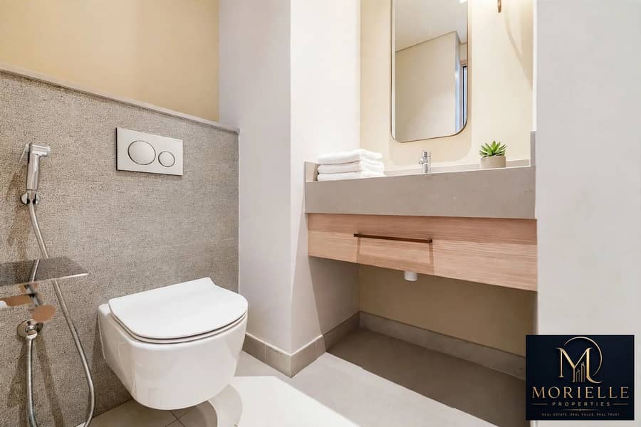 14 843776647-1066x800-edited-add-folded-towels-and-a-small-plant-to-the-guest-b. jpg