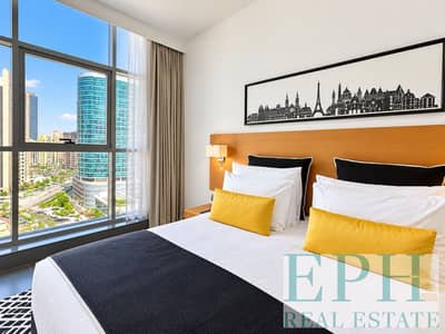 شقة فندقية  للبيع في برشا هايتس (تيكوم)، دبي - Modern Hotel Bedroom with City Views. png