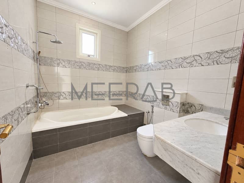 8 Bright Modern Tiled Bathroom. png