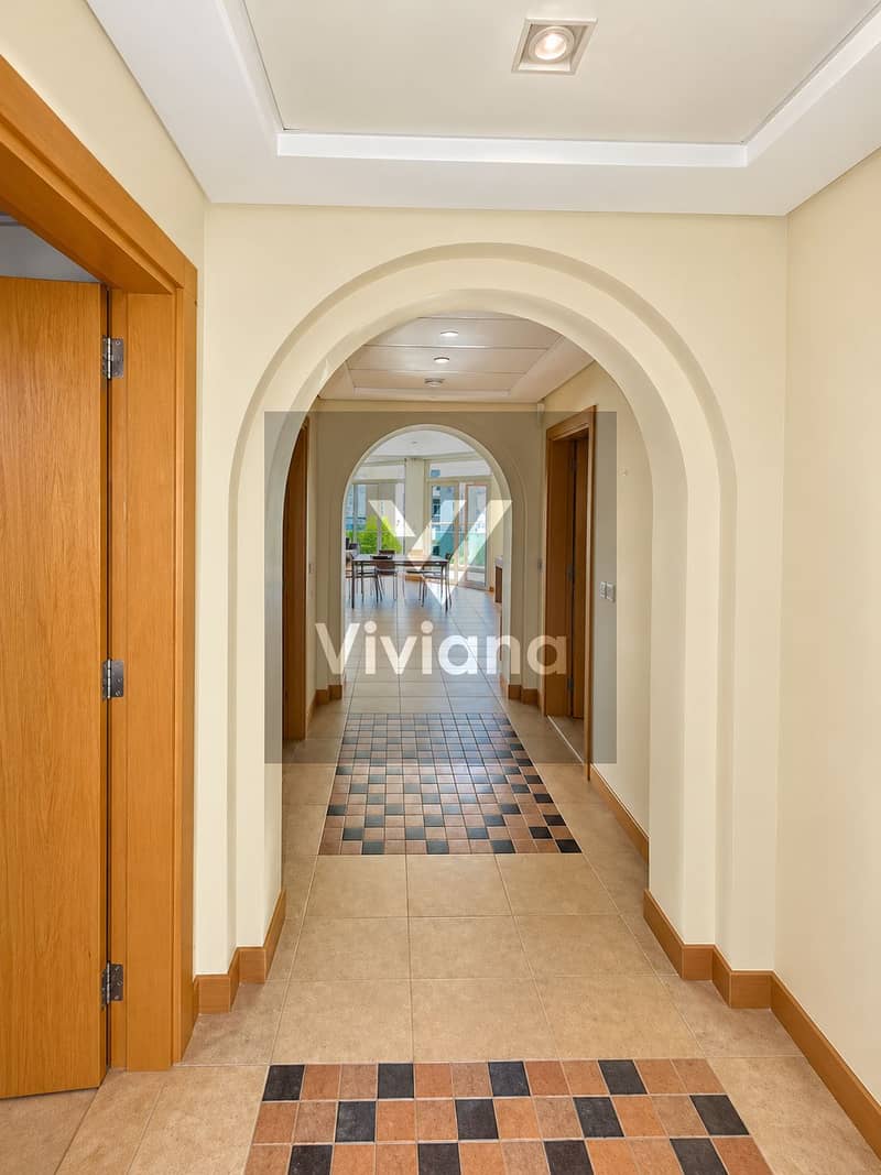 8 Warm Archway Hallway with Sunlit Dining Room. png