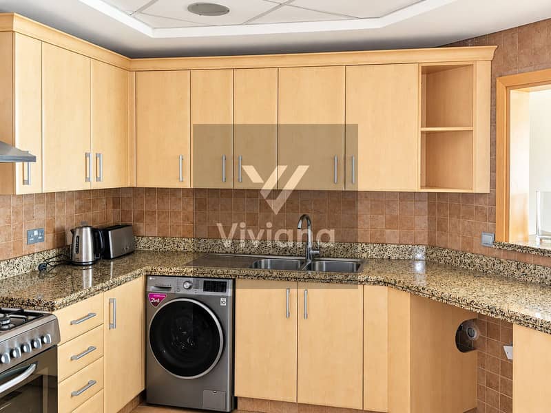 13 Bright Modern Maple Kitchen with Stainless Appliances. png
