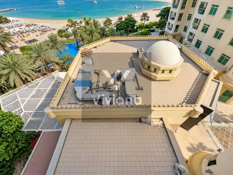 23 Rooftop Machinery Above a Turquoise Resort Coast. png