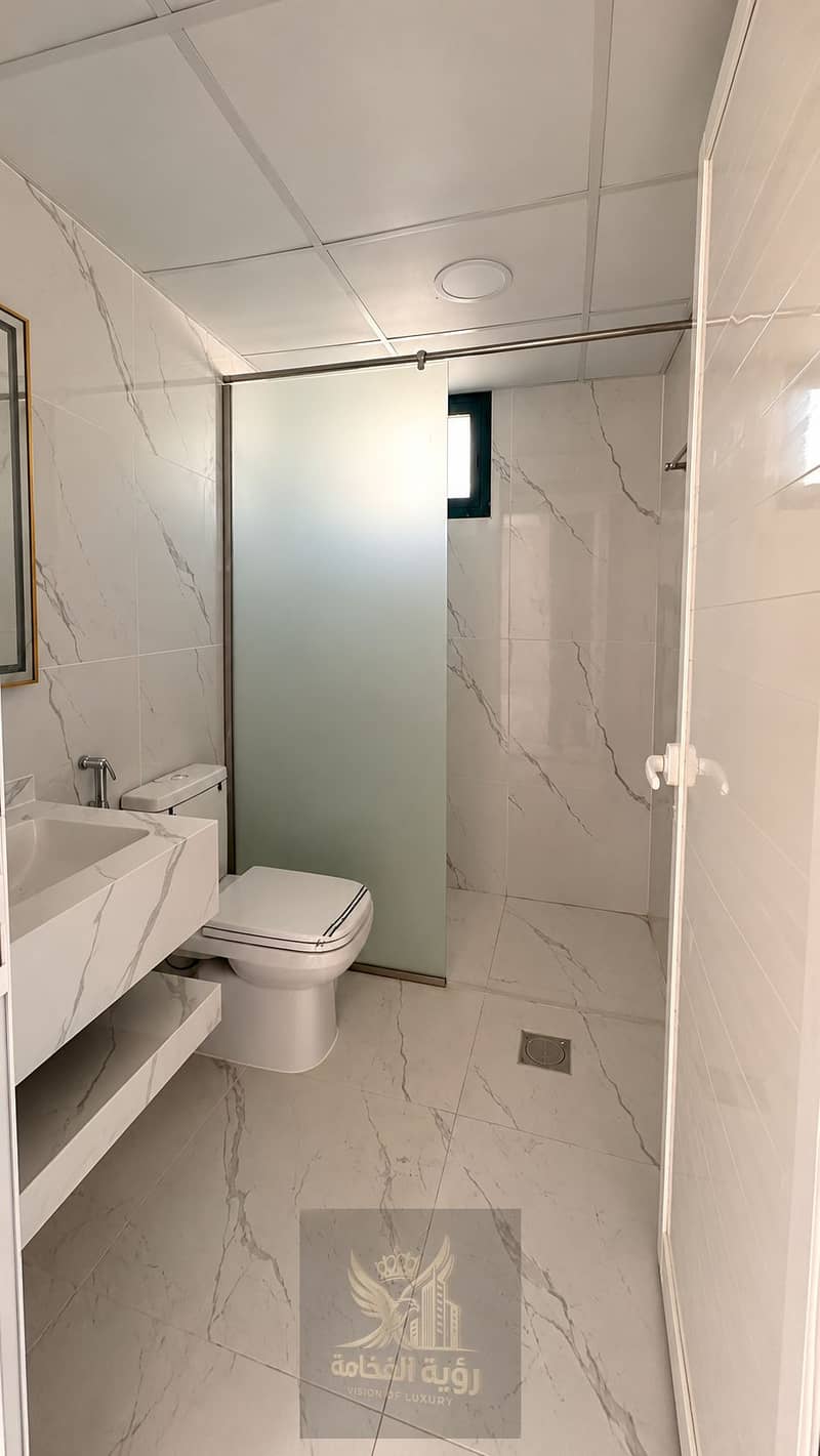 5 Marble-Tiled Modern Bathroom. png