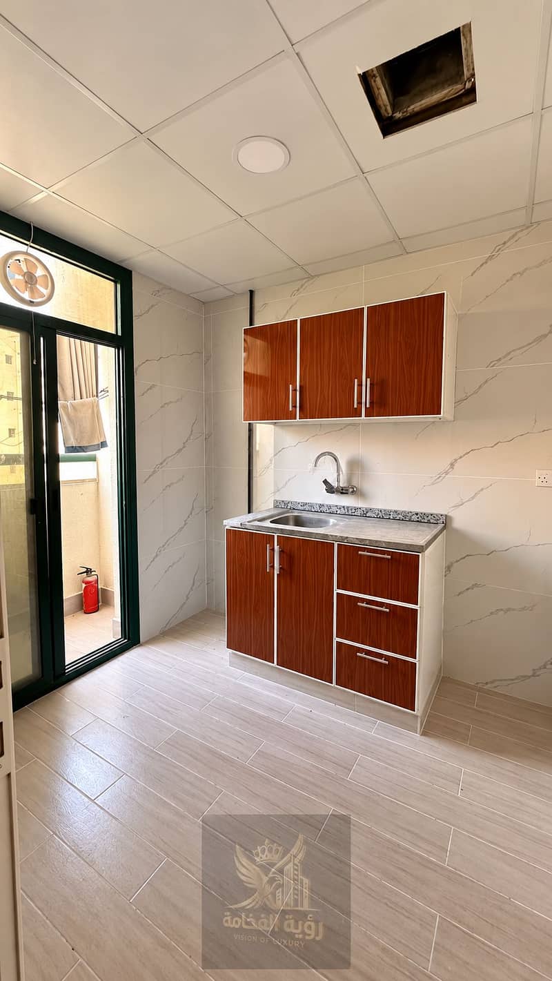 6 Modern Beige Kitchenette with Balcony Door. png