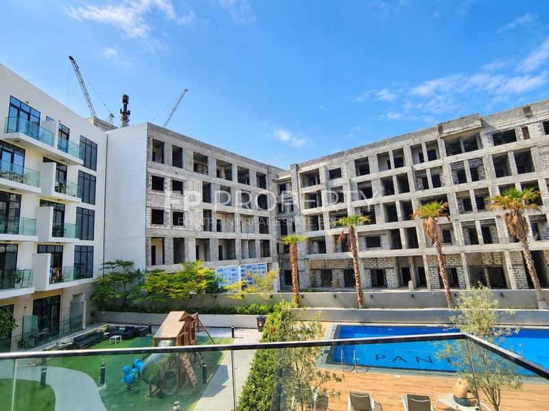 5 Modern Courtyard with Construction Cranes. png