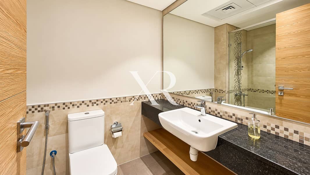 13 Modern Beige Bathroom with Wood Accents. png