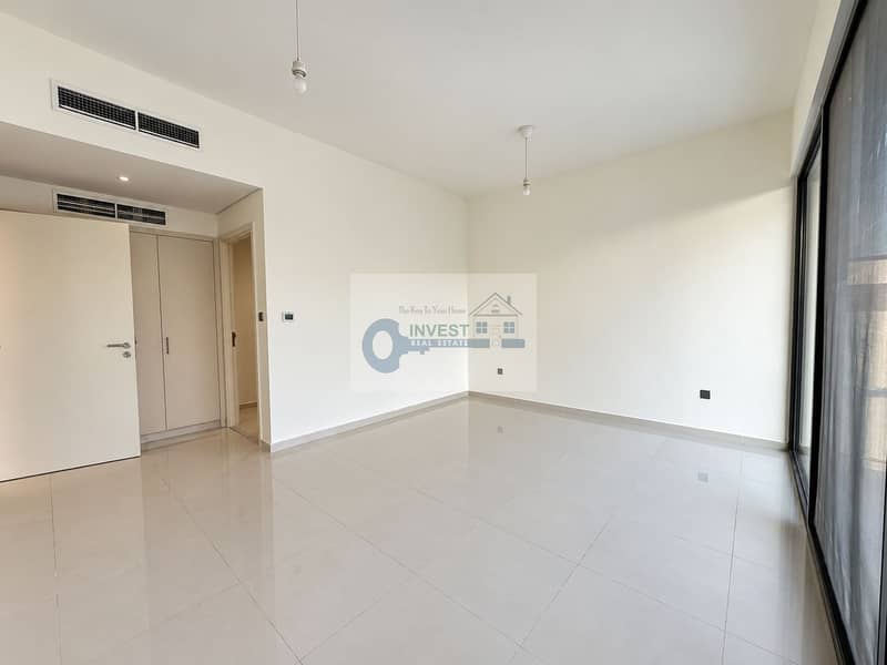 8 Modern Vacant Room with Glass Balcony Views. png