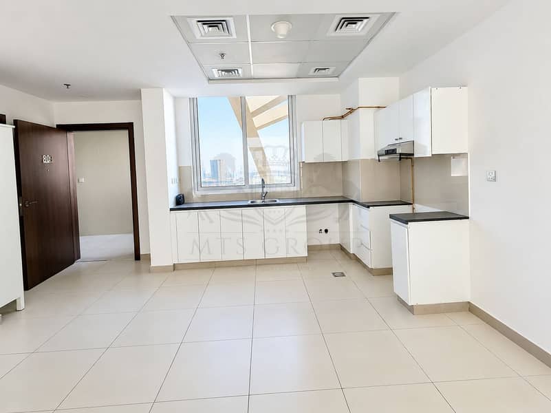 2 Bright Minimalist Kitchen with City View. png