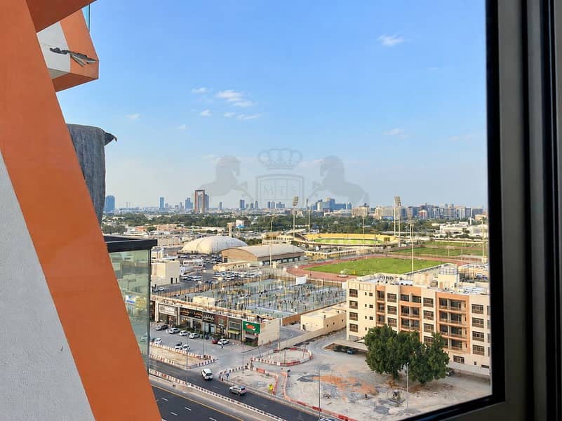 8 City Skyline Overlooking a Sports Complex. png