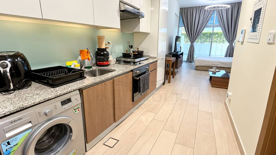 2 Modern Compact Studio Kitchen and Living Space. png