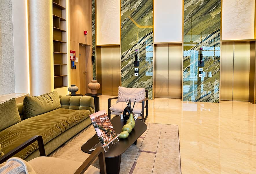 10 Luxury Lobby with Marble Elevators and Lounge Seating. png