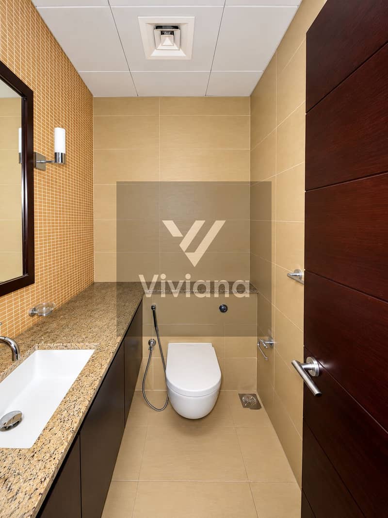 12 Modern Beige-Tiled Bathroom Interior. png