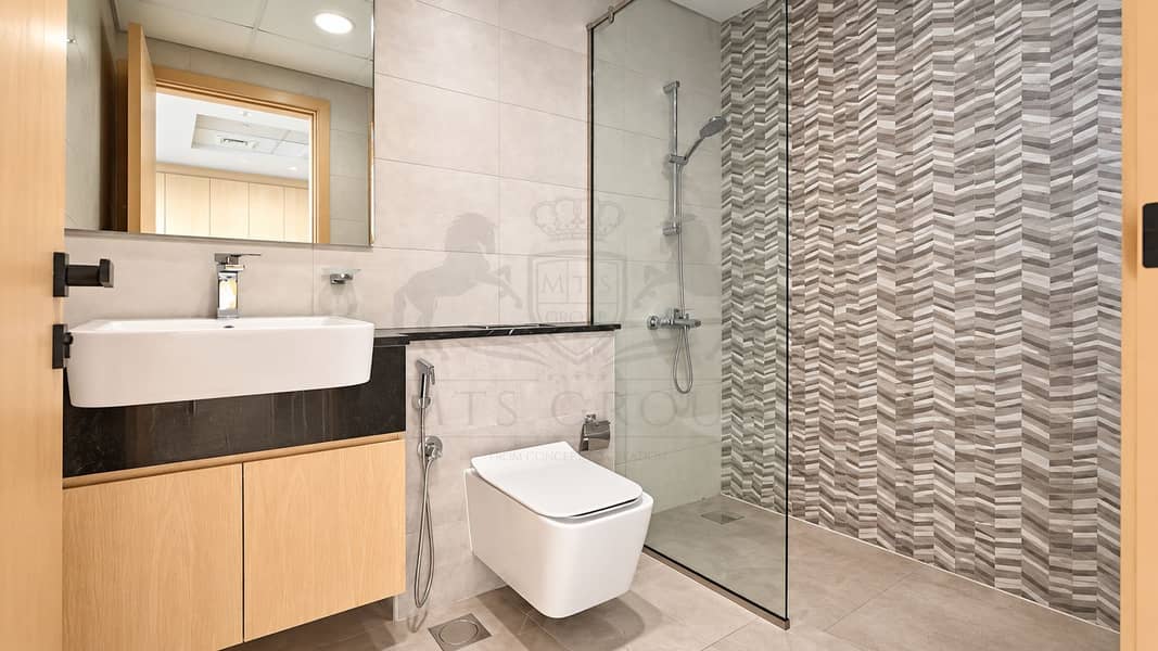 14 Modern Neutral Bathroom with Chevron Shower Wall. png
