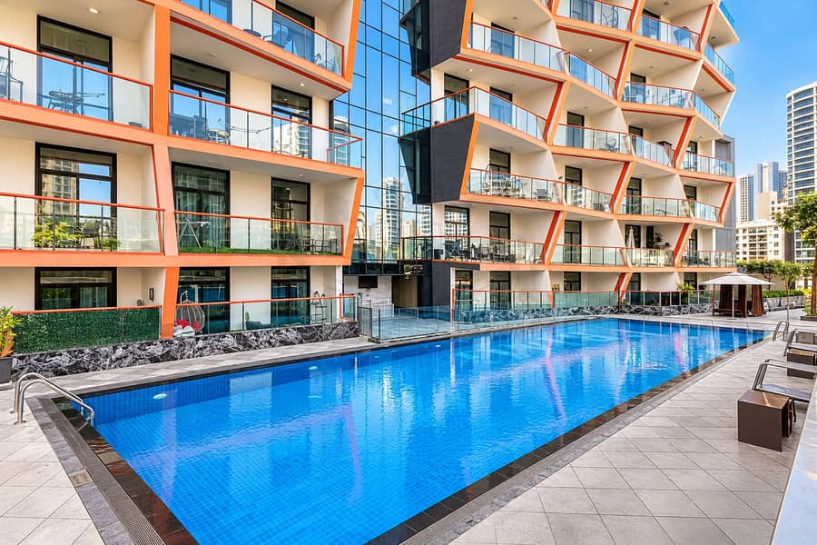 19 Modern Courtyard Pool with Orange Balconies. png