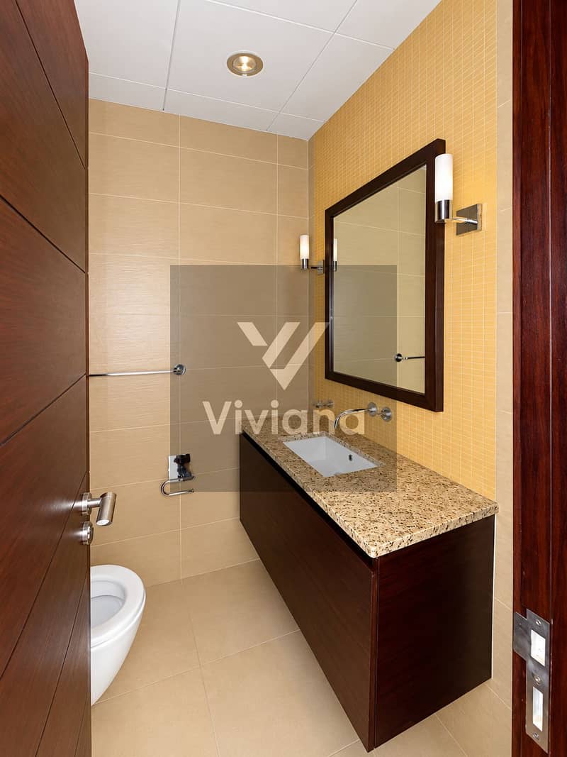 12 Modern Beige and Wood Powder Room. png