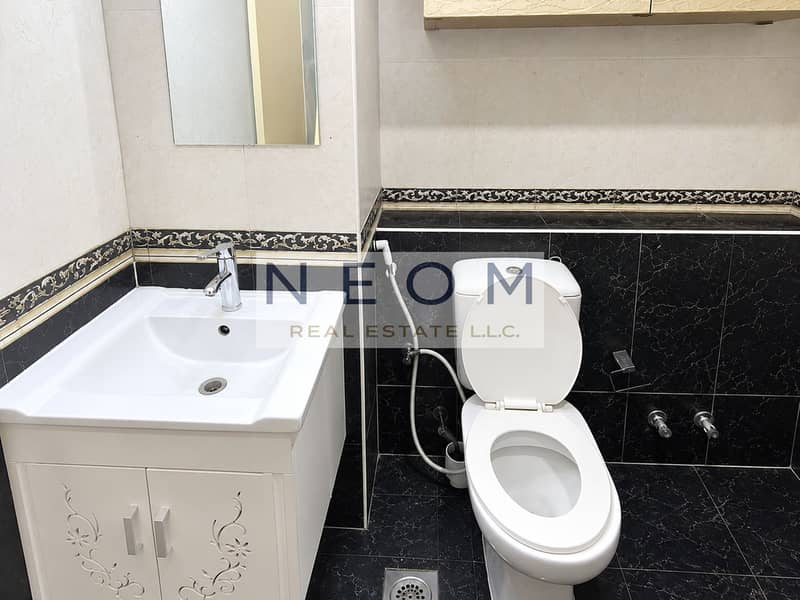 6 Elegant Cream and Charcoal Tile Bathroom. png