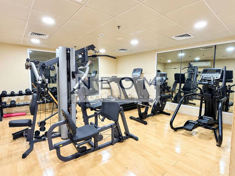 9 Modern Gym with Mirrored Fitness Equipment. png