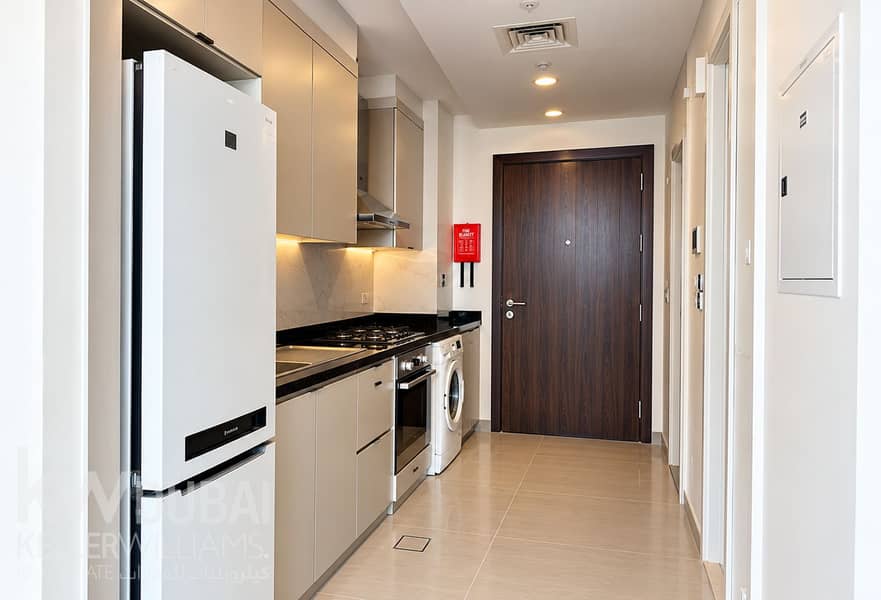 2 Modern Galley Kitchen and Entryway. png