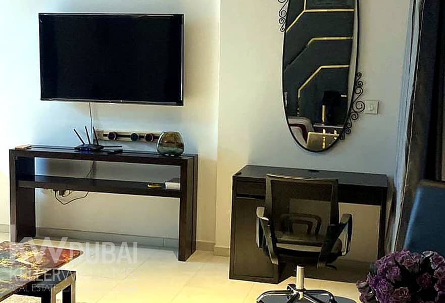 enhanced_photo_7_tv_desk_area. png enhanced_photo_7_tv_desk_area. png