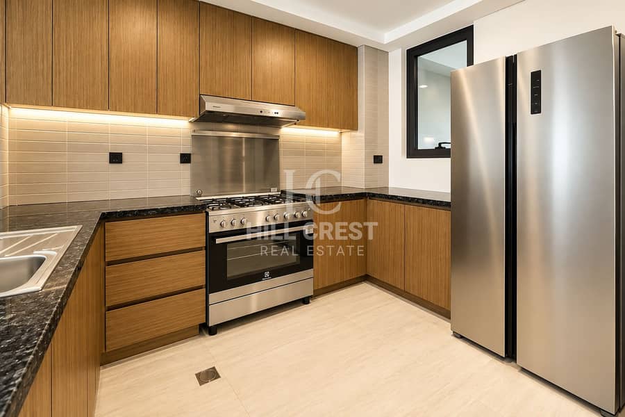 5 Modern Oak Kitchen with Stainless Appliances. png