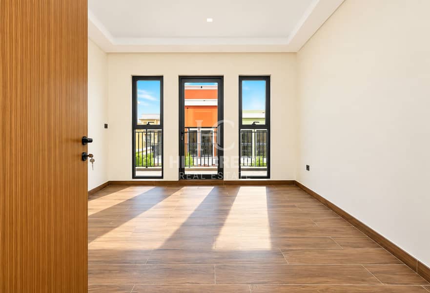 7 Sunlit Minimal Room with Balcony Views. png