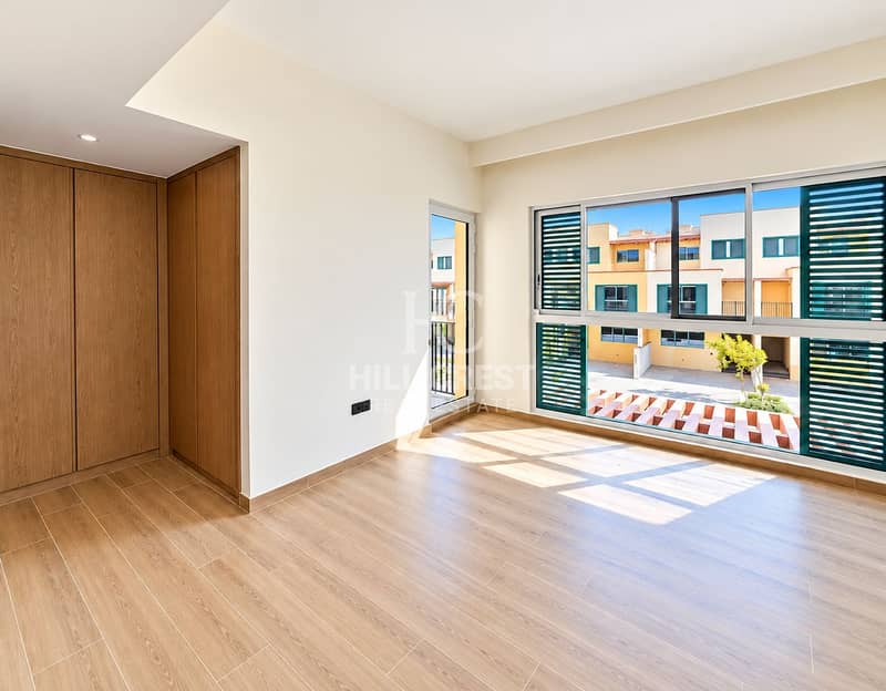 4 Sunlit Minimalist Room with Townhouse Views. png