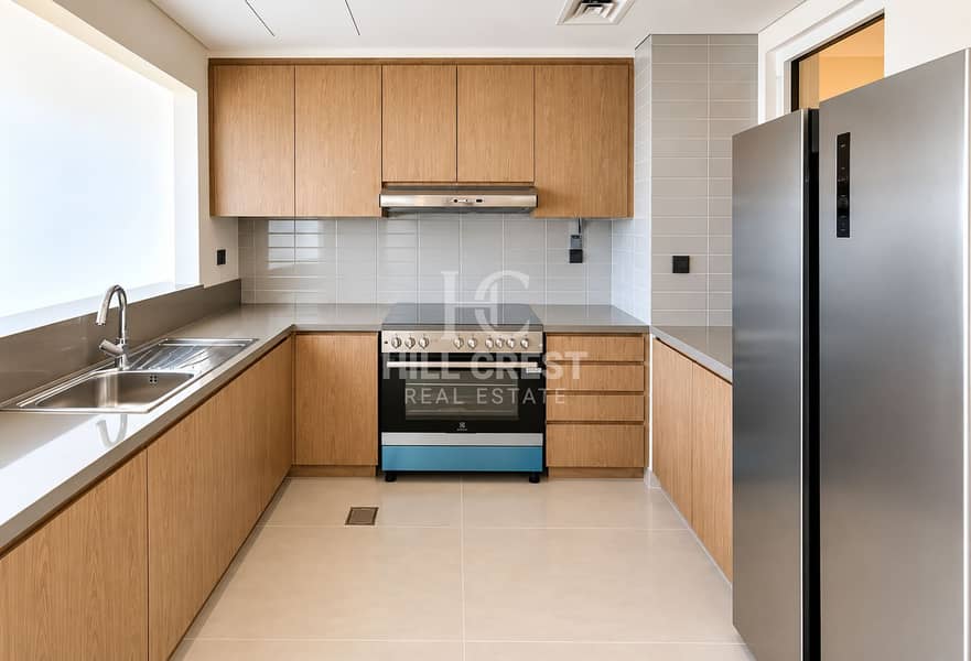 7 Modern Minimalist Wood-Tone Kitchen. png