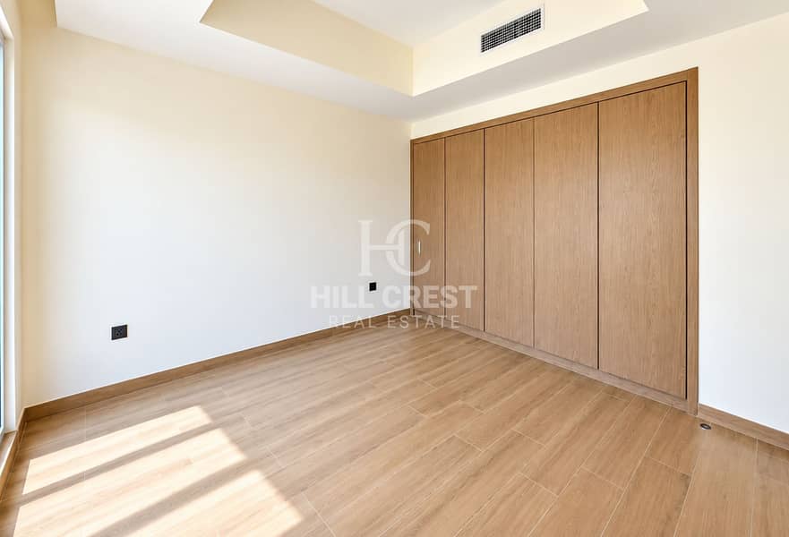 8 Sunlit Modern Bedroom with Oak Wardrobe. png