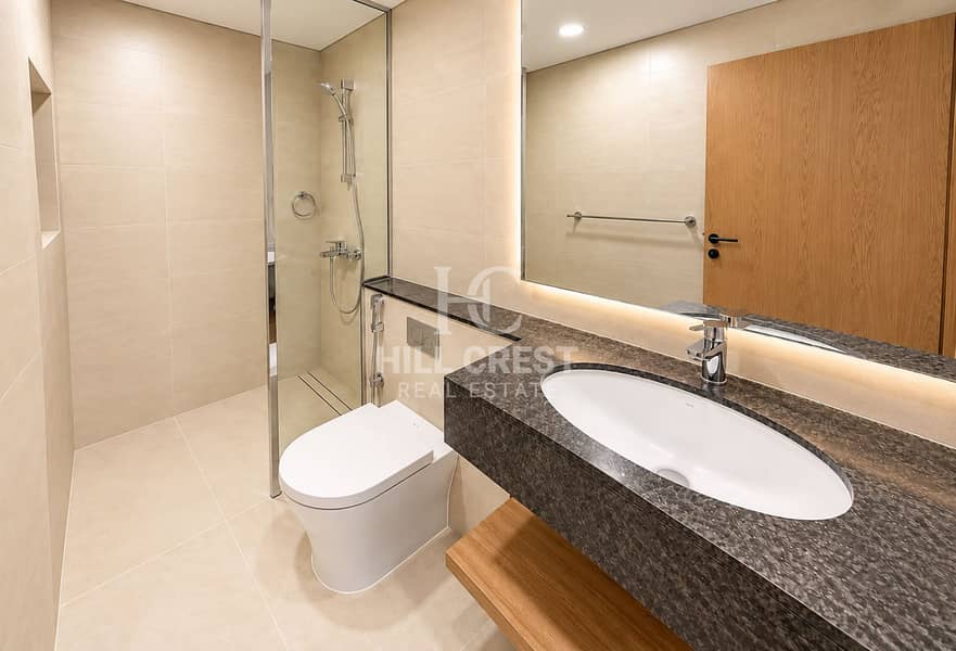 12 Modern Beige Bathroom with Oak Accents. png