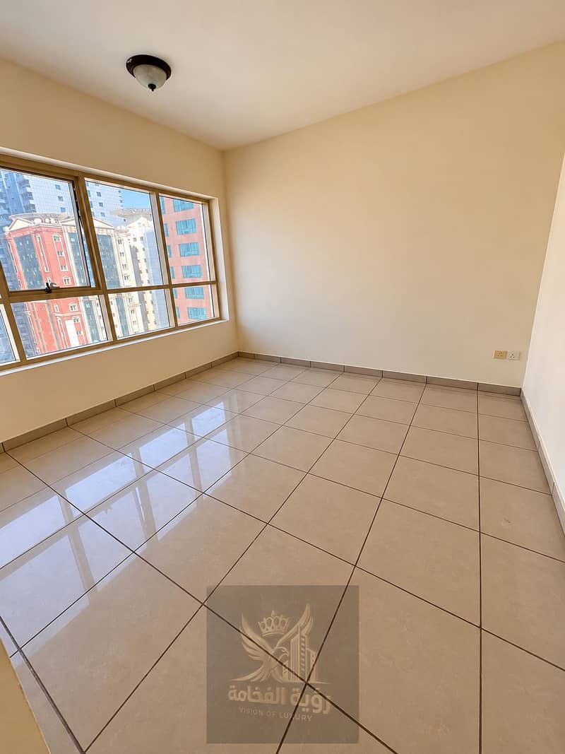2 Bright Empty Room with City Views. png