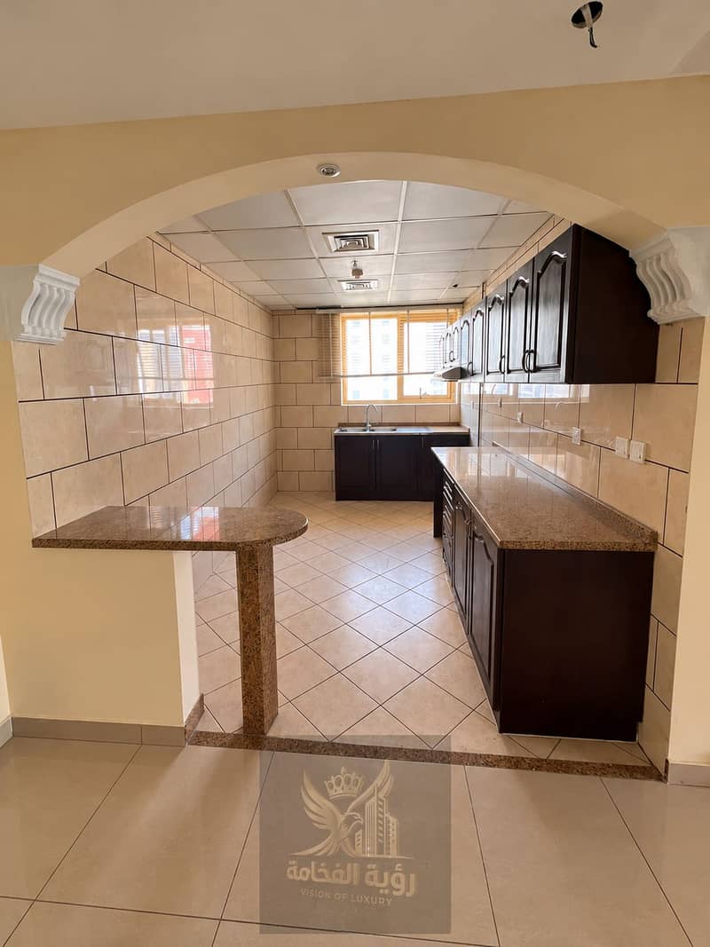 5 Arched Entry to a Warm Galley Kitchen. png