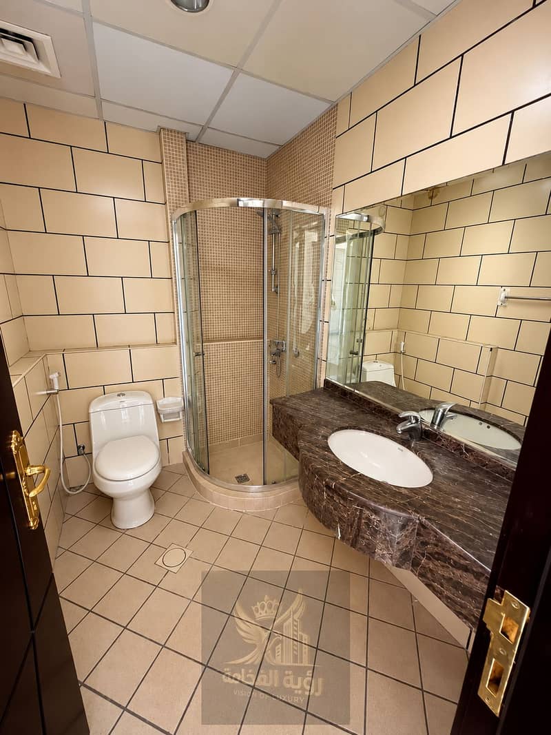 8 Modern Beige Tiled Bathroom Interior. png