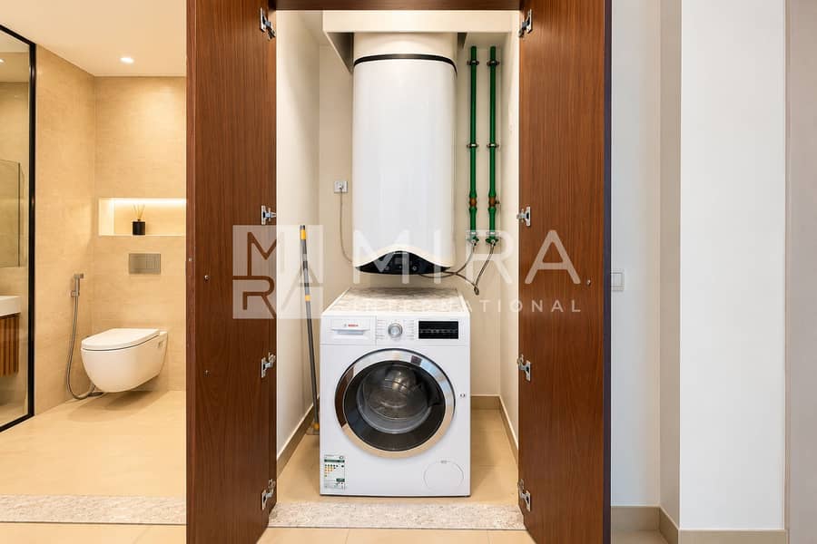 10 Modern Laundry Closet with Open Walnut Doors